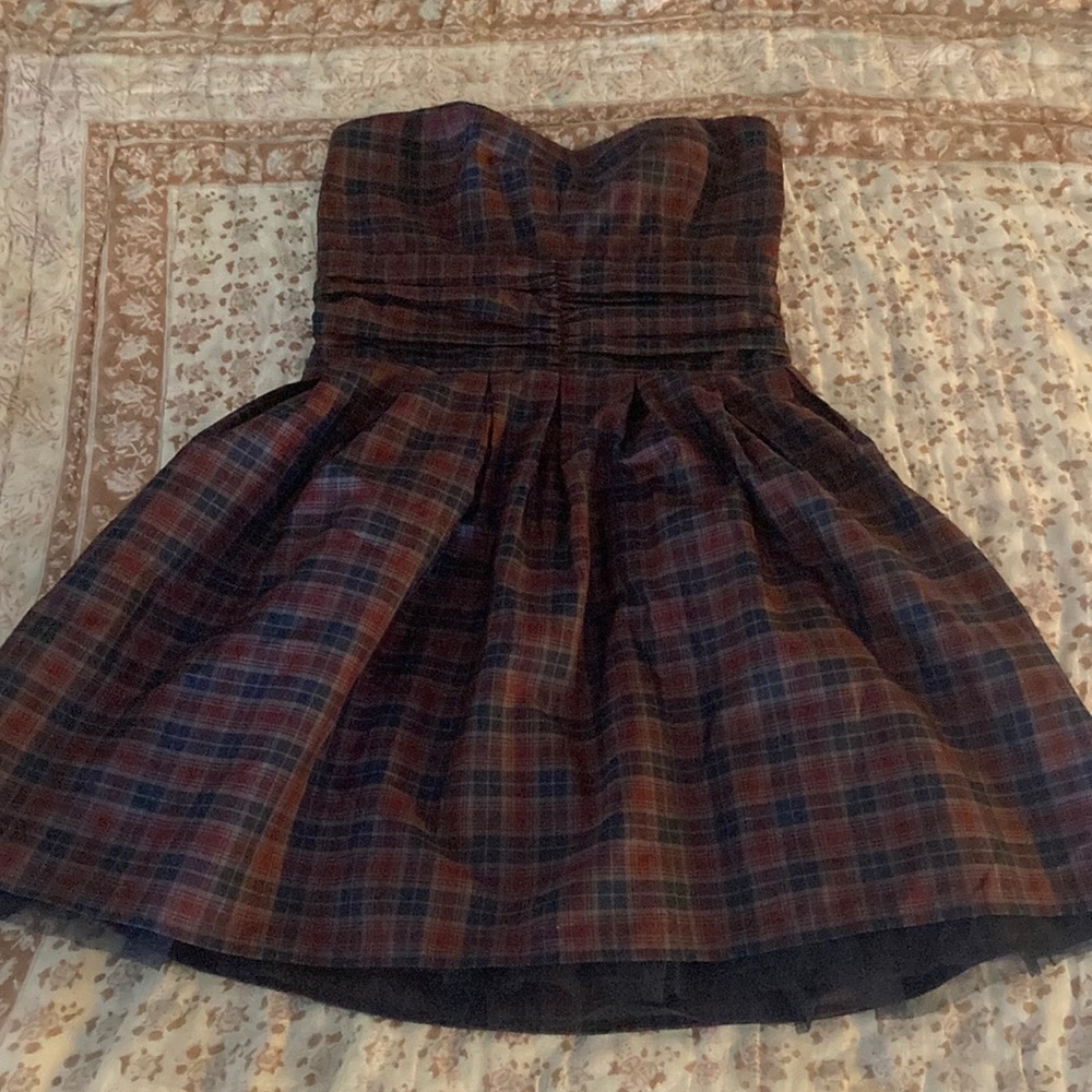 Alternative strapless ruched plaid corset top dress.